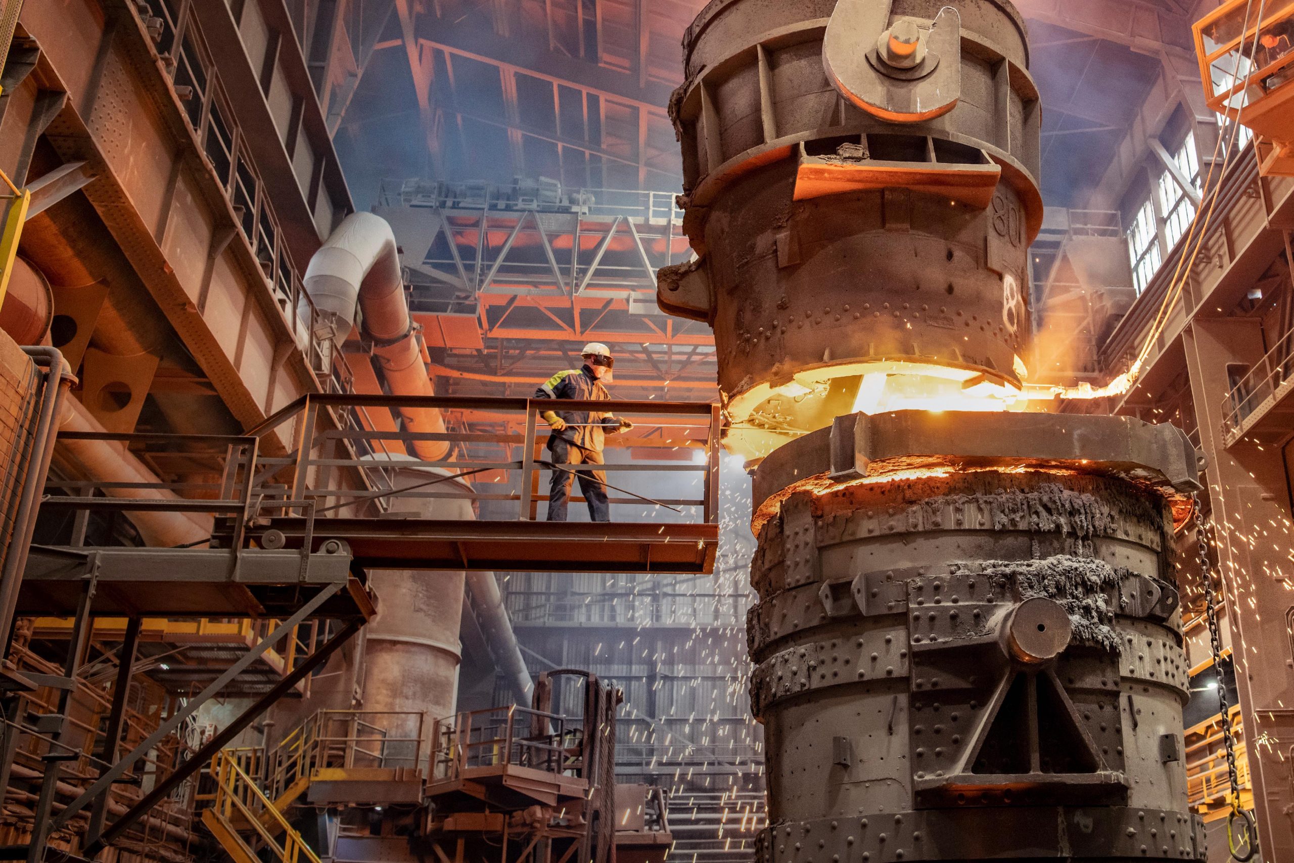Steelworker starting molten steel